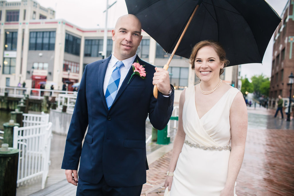brielle-davis-events-torped-factory-wedding-bride-and-groom-outside-umbrella-raining-photography-by-brea.jpg
