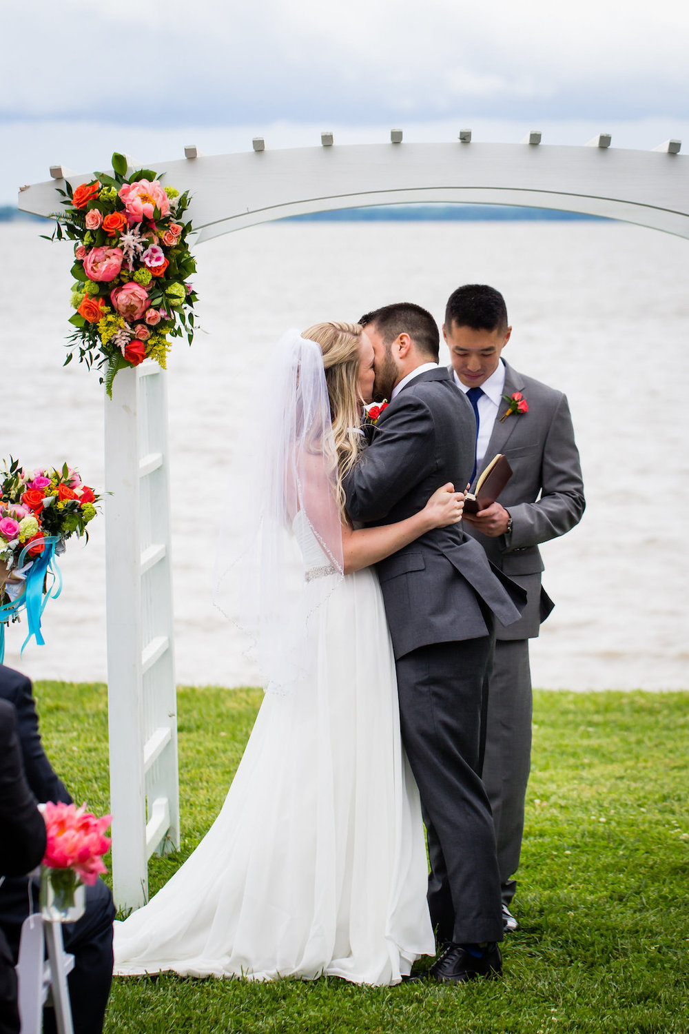 brielle-davis-events-weatherly-farm-waterfront-wedding-ceremony-kiss.jpg